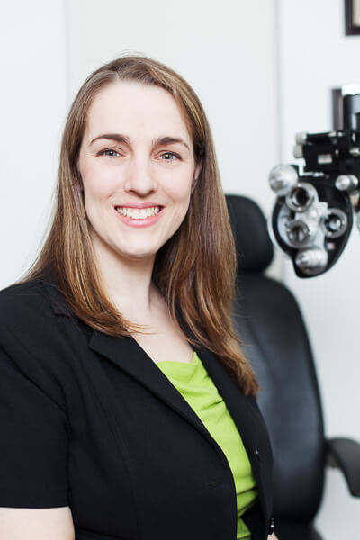 Dr. Jennifer Davis smiling in an exam room
